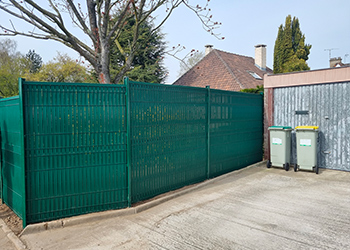 Pose d'une clôture à Sint-Omer 